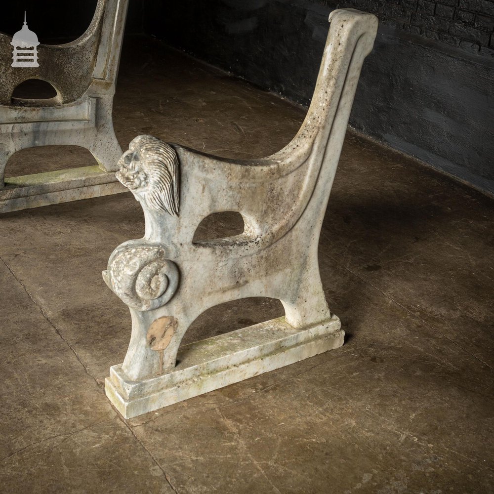 Pair of Weathered Marble Bench Ends with Carved Dragon Design