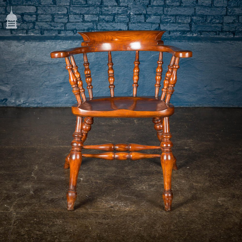 19th C Elm Captain’s Bow Seat Smokers Chair with Turned Arm Supports and Double H Stretcher