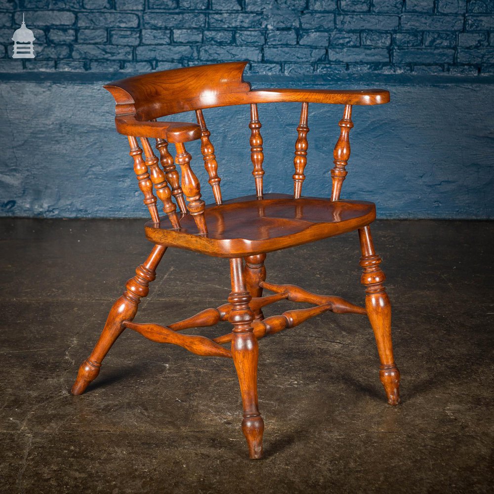 19th C Elm Captain’s Bow Seat Smokers Chair with Turned Arm Supports and Double H Stretcher