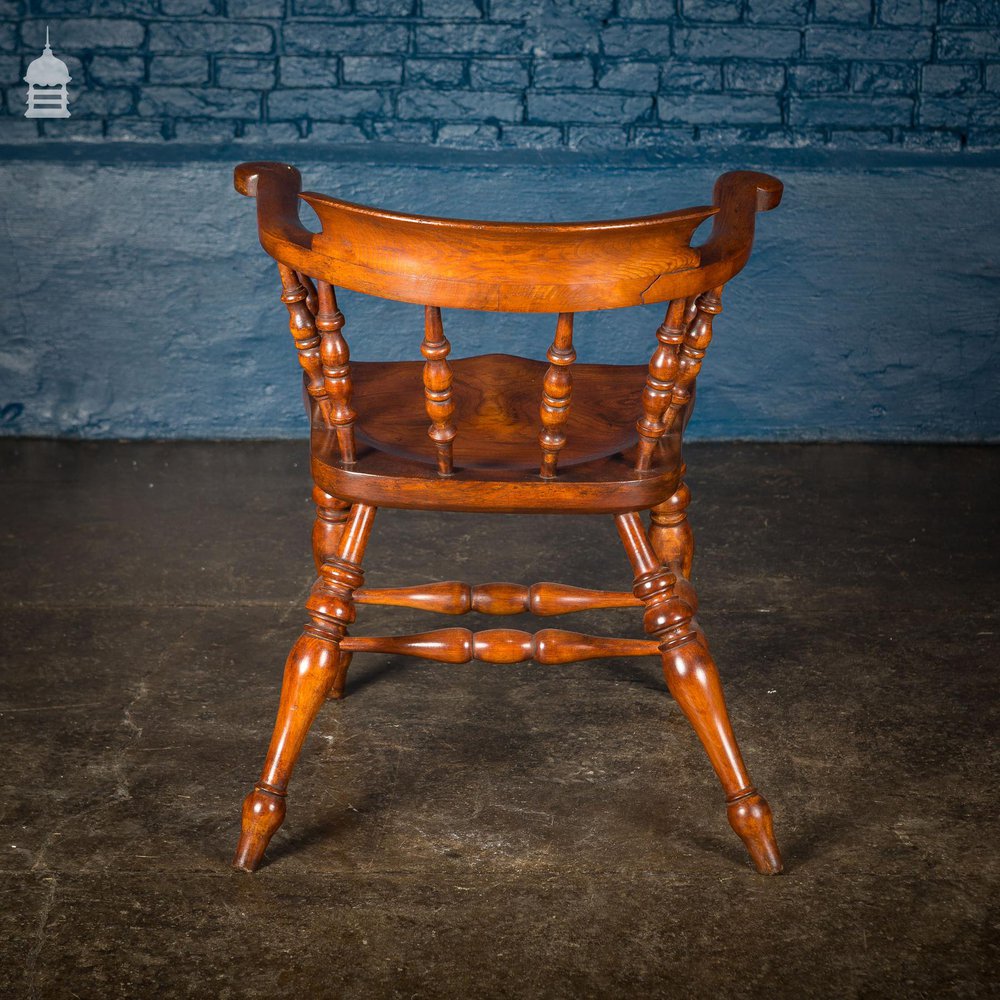 19th C Elm Captain’s Bow Seat Smokers Chair with Turned Arm Supports and Double H Stretcher