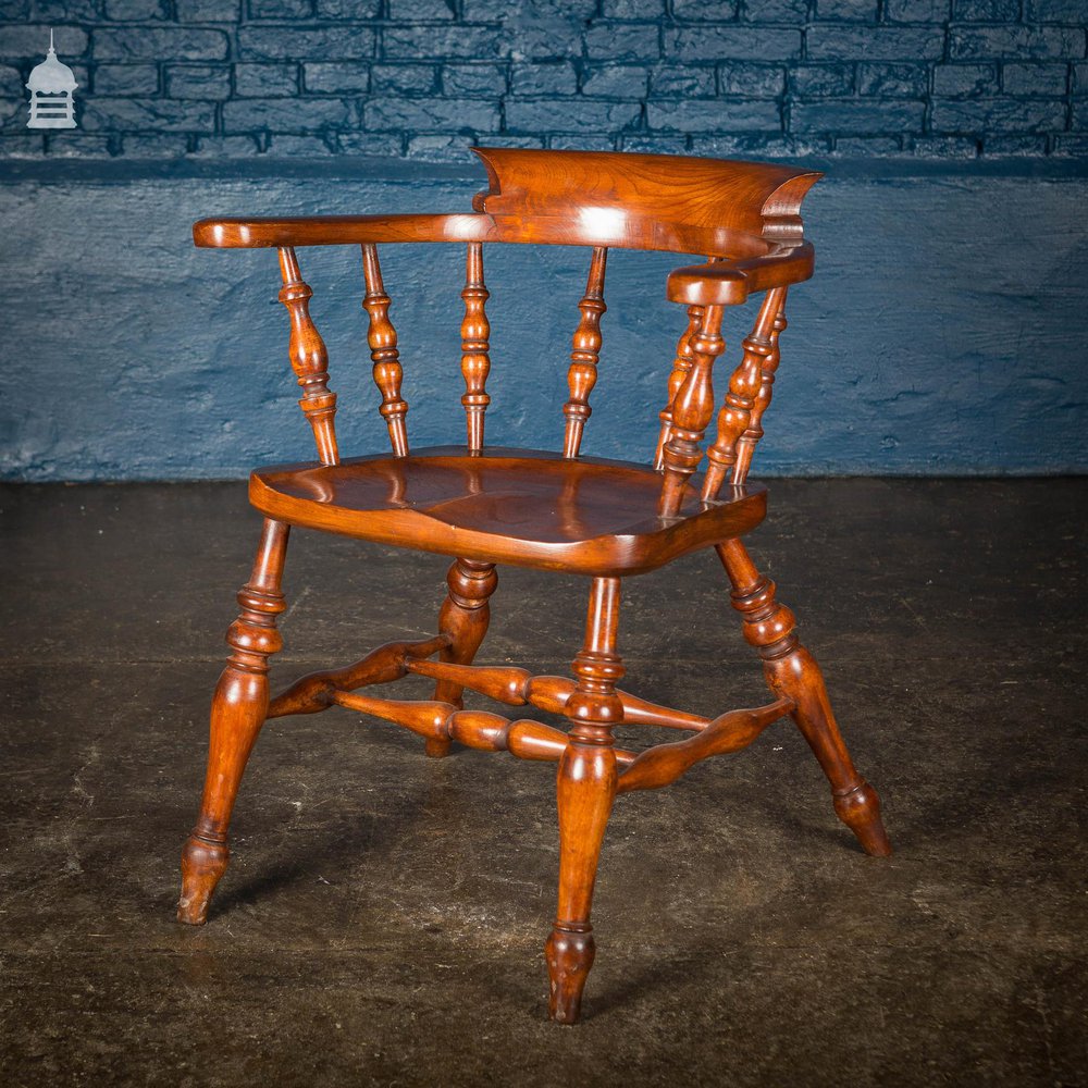 19th C Elm Captain’s Bow Seat Smokers Chair with Turned Arm Supports and Double H Stretcher