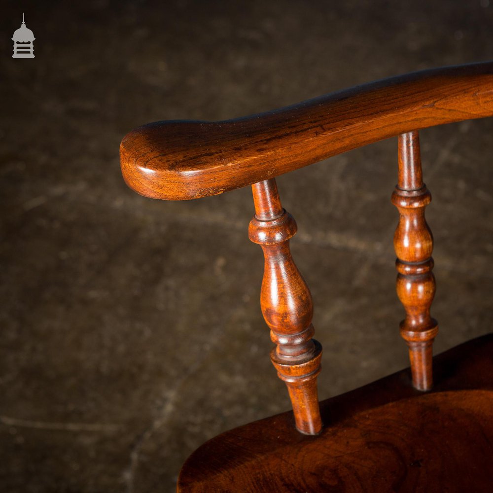 19th C Elm Captain’s Bow Seat Smokers Chair with Turned Arm Supports and Double H Stretcher