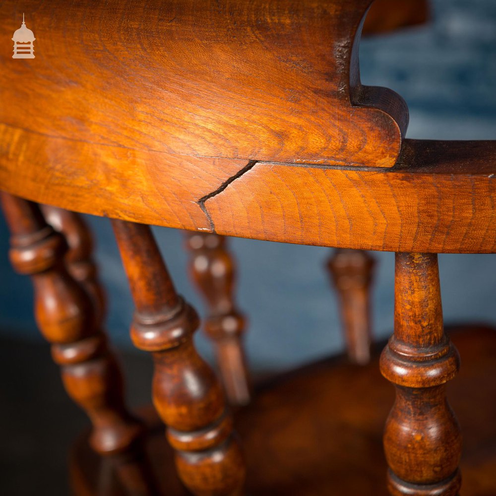 19th C Elm Captain’s Bow Seat Smokers Chair with Turned Arm Supports and Double H Stretcher