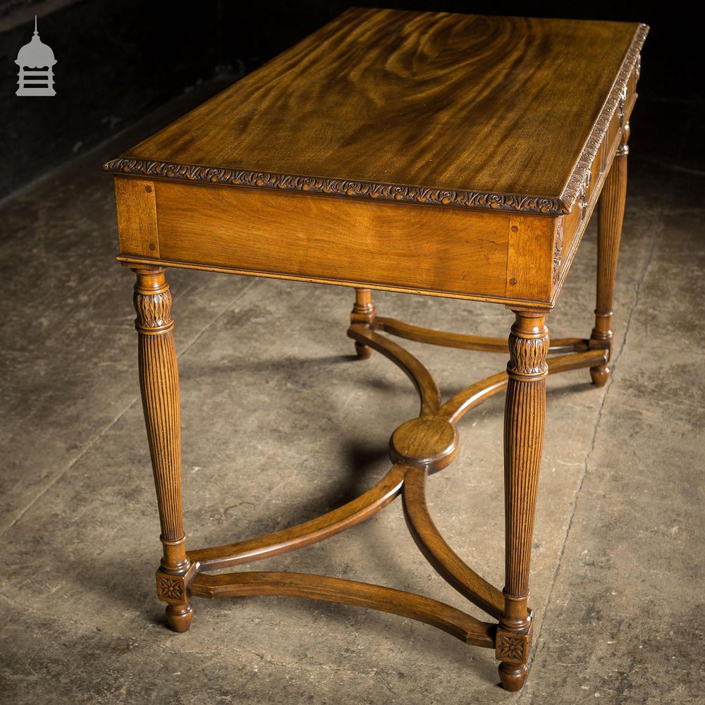 A Fine Late 19th C Sheraton Style Writing Table with Carved Prince of Wales Feathers Escutcheons and Elegant Mellon Fluted Legs.