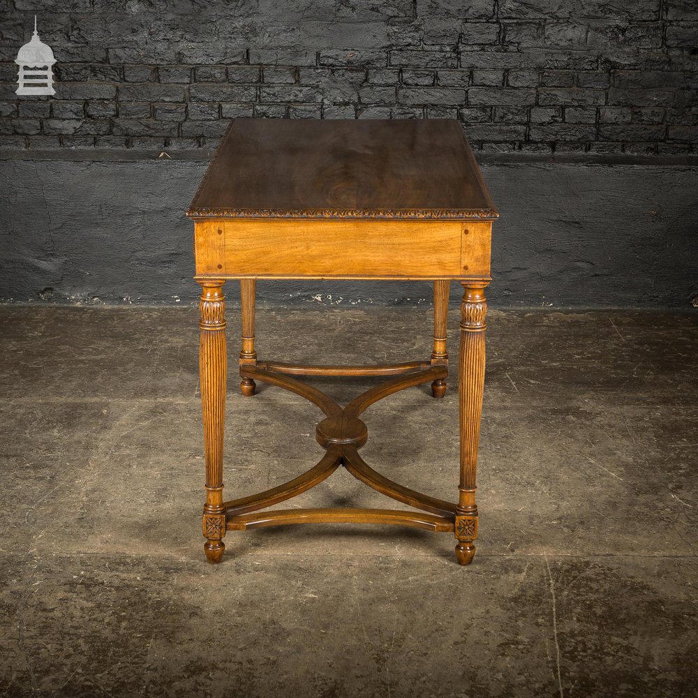 A Fine Late 19th C Sheraton Style Writing Table with Carved Prince of Wales Feathers Escutcheons and Elegant Mellon Fluted Legs.