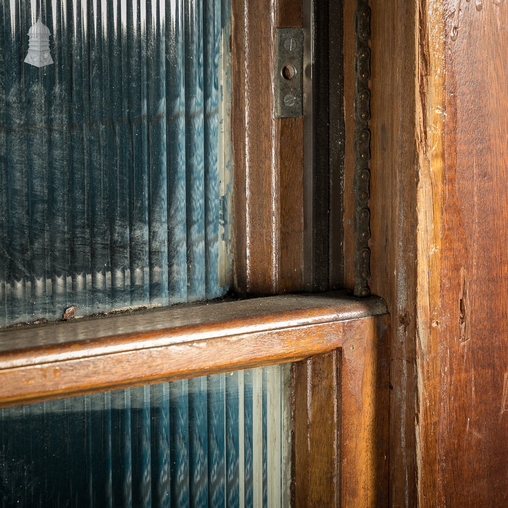 Hardwood sliding sash windows, 8ft high with textured glazing.