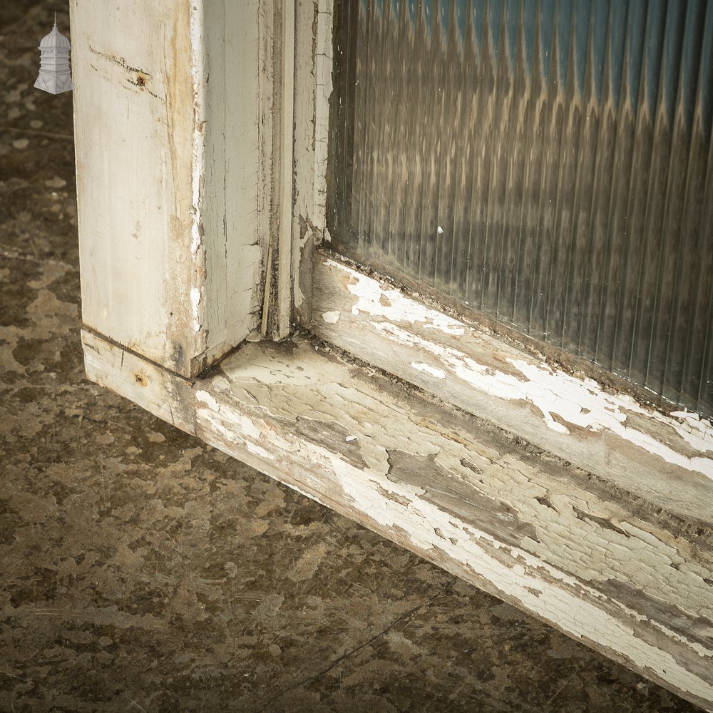 Hardwood sliding sash windows, 8ft high with textured glazing.