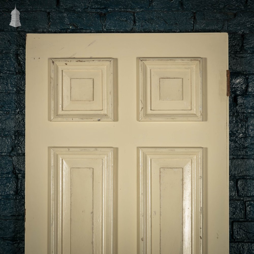 Heavy fire door with mouldings on one side to create panelled appearance.