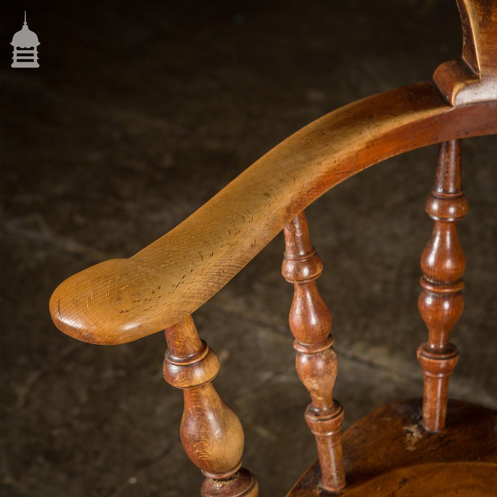 19th C Elm Captains Bow Seat Smokers Chair with Turned Arm Support and Double H Stretcher