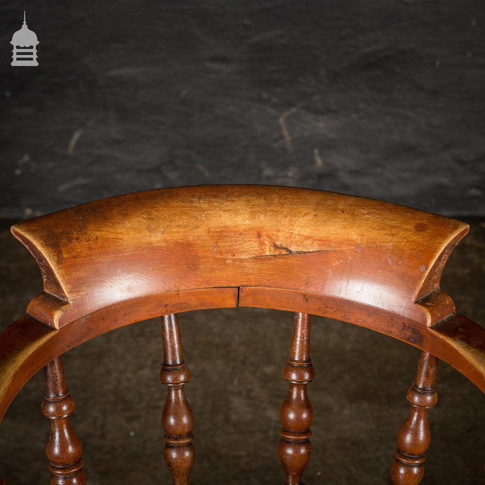 19th C Elm Captains Bow Seat Smokers Chair with Turned Arm Support and Double H Stretcher