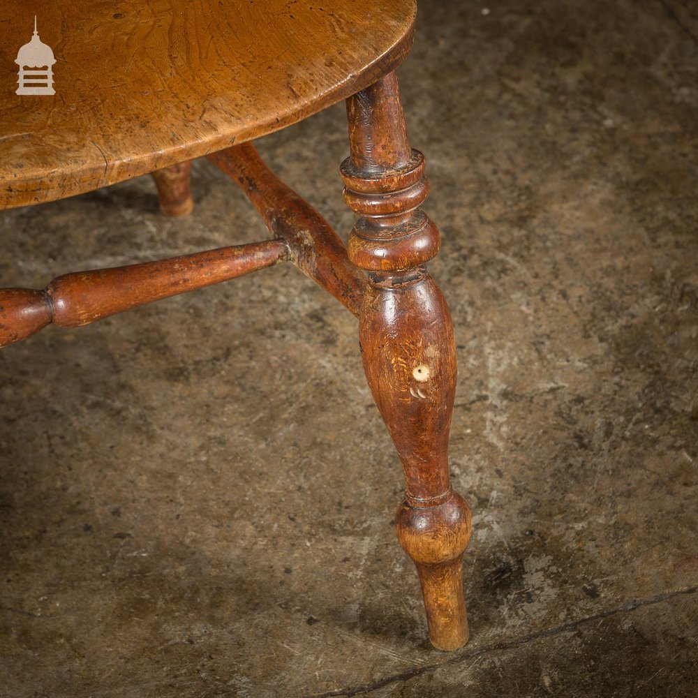 19th C Elm Captains Bow Seat Smokers Chair with Turned Arm Support and Double H Stretcher