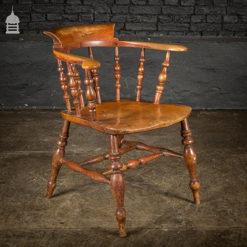 19th C Elm Captains Bow Seat Smokers Chair with Turned Arm Support and Double H Stretcher