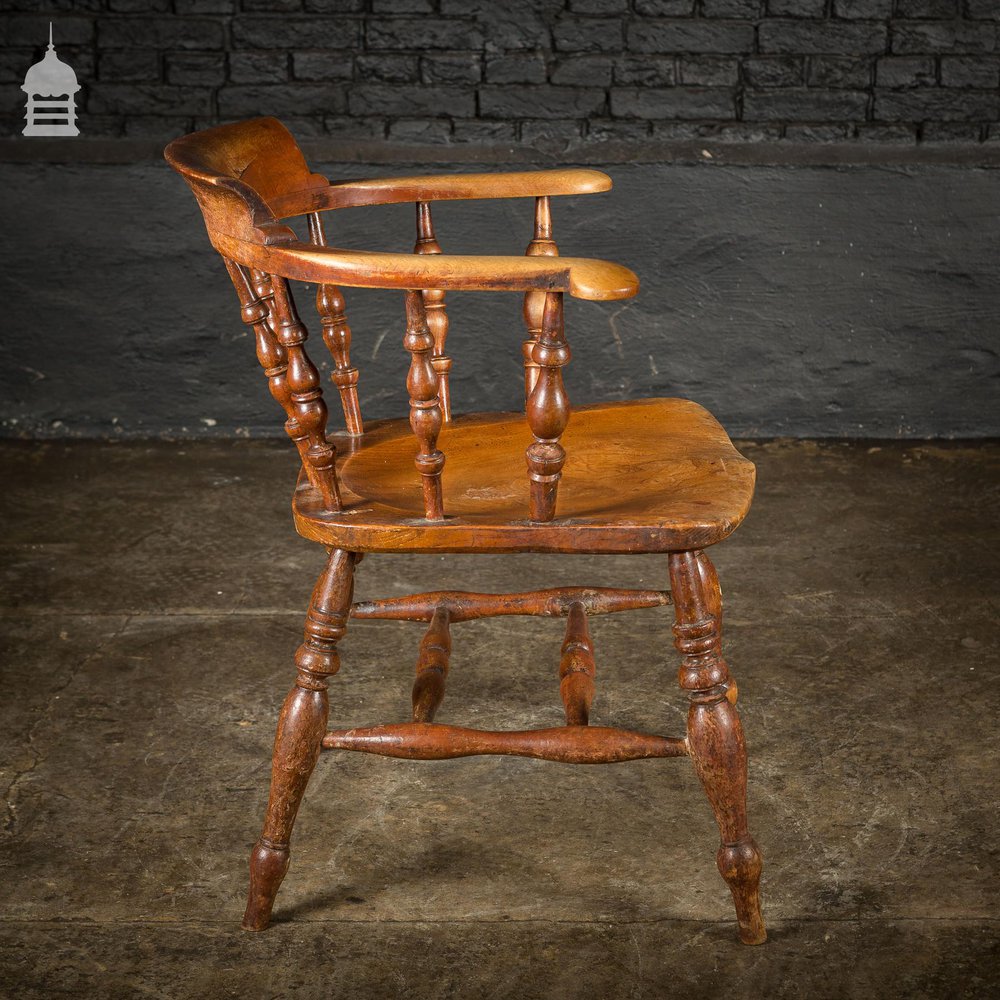 19th C Elm Captains Bow Seat Smokers Chair with Turned Arm Support and Double H Stretcher