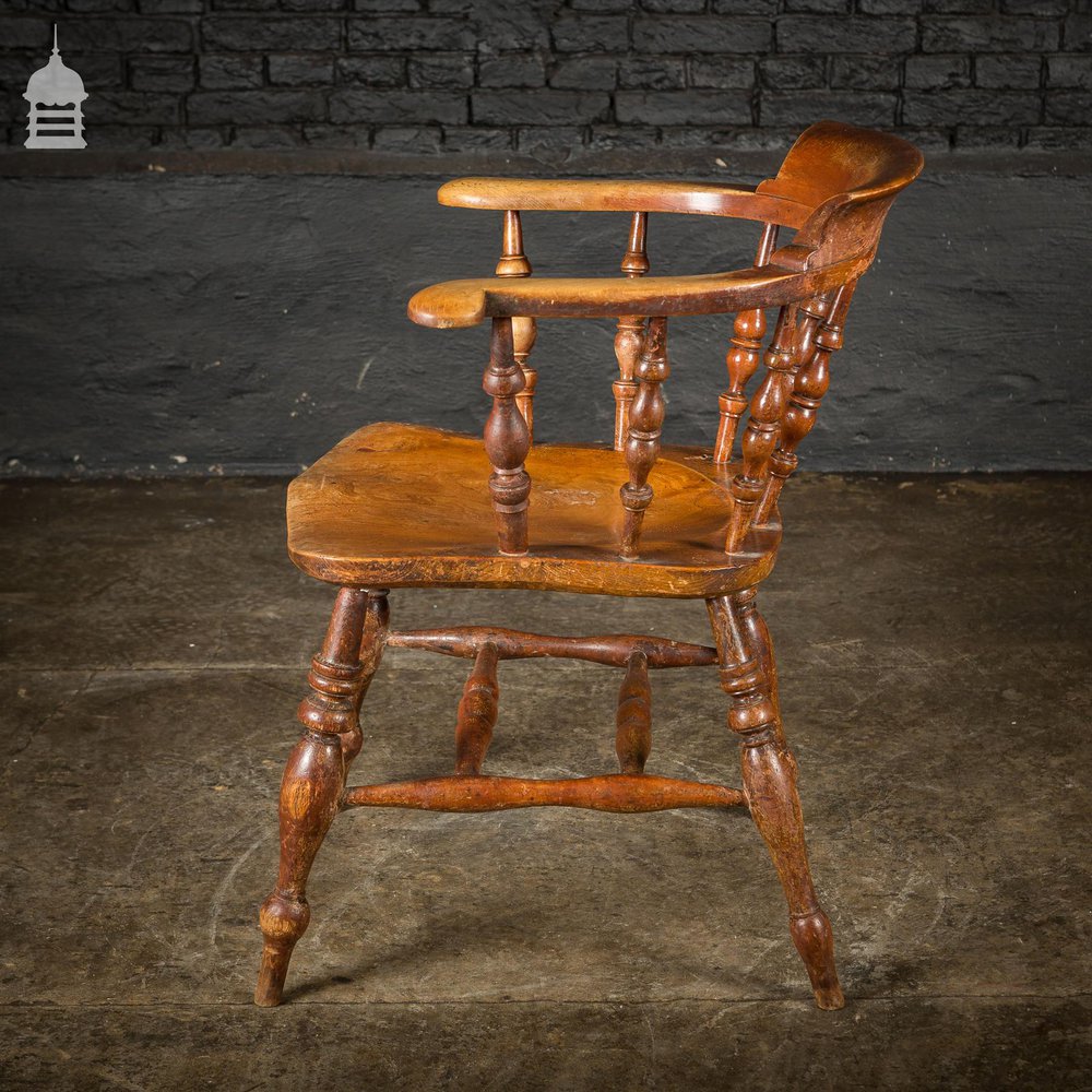 19th C Elm Captains Bow Seat Smokers Chair with Turned Arm Support and Double H Stretcher